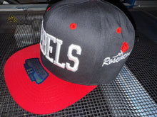 Load image into Gallery viewer, REBELS -RED ZONE 2025 SNAP BACK ADULT CAP - BLACK/RED WITH 3D LOGO EMBROIDERED FRONT AND ROSEMEAD WITH ROSE ON SIDE