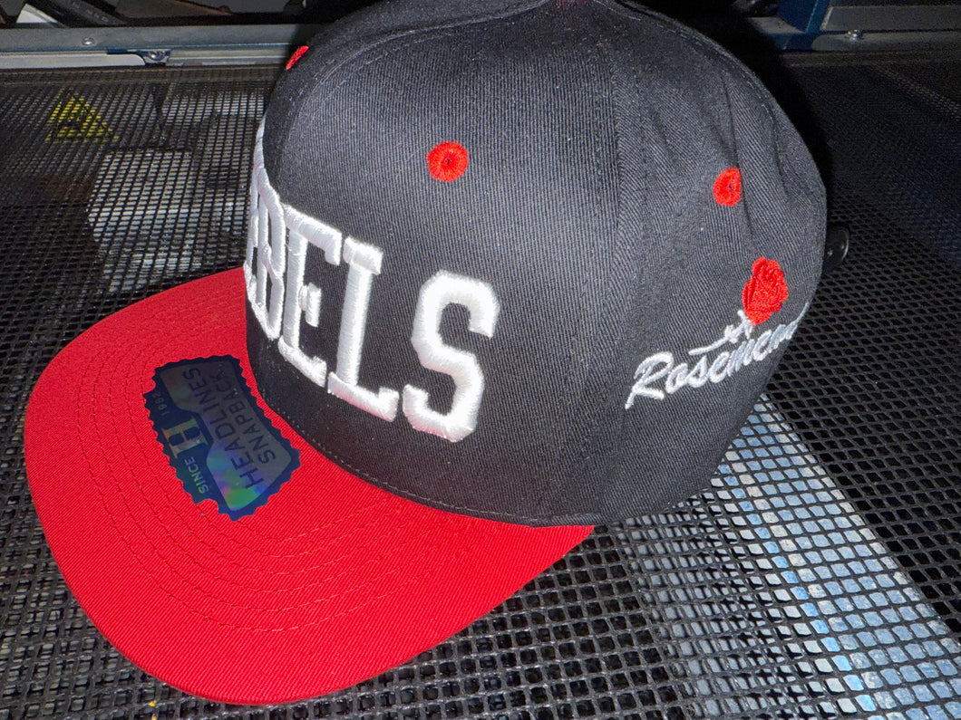 REBELS -RED ZONE 2025 SNAP BACK ADULT CAP - BLACK/RED WITH 3D LOGO EMBROIDERED FRONT AND ROSEMEAD WITH ROSE ON SIDE