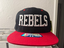 Load image into Gallery viewer, REBELS -RED ZONE 2025 SNAP BACK ADULT CAP - BLACK/RED WITH 3D LOGO EMBROIDERED FRONT AND ROSEMEAD WITH ROSE ON SIDE